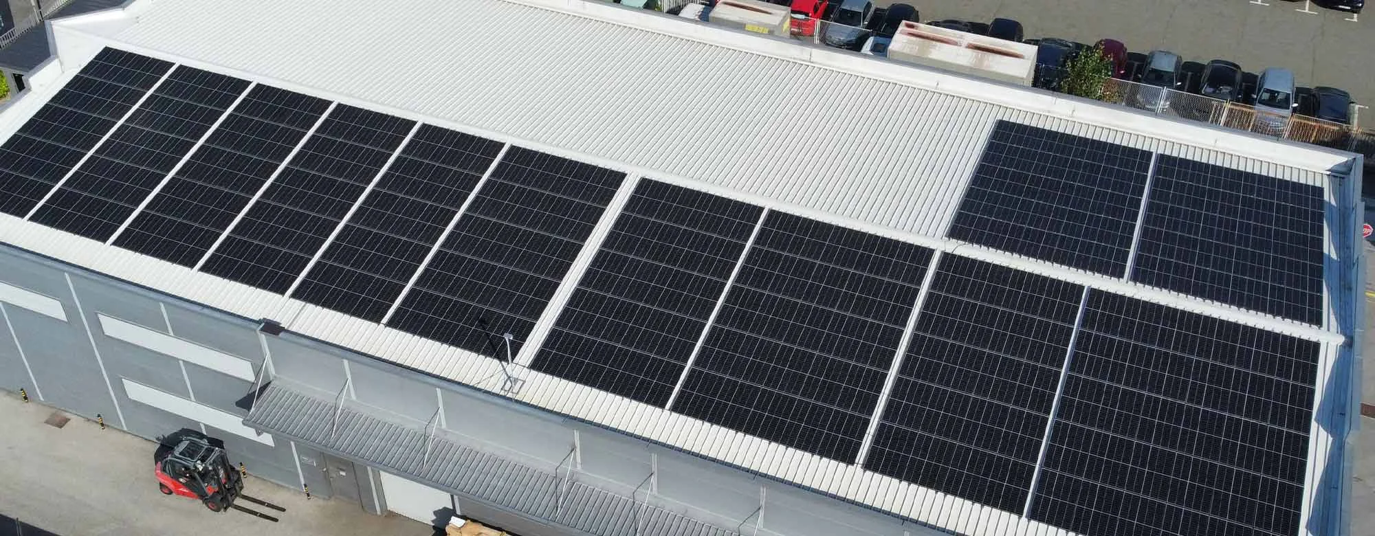 Aerial shot of factory roof with solar panels