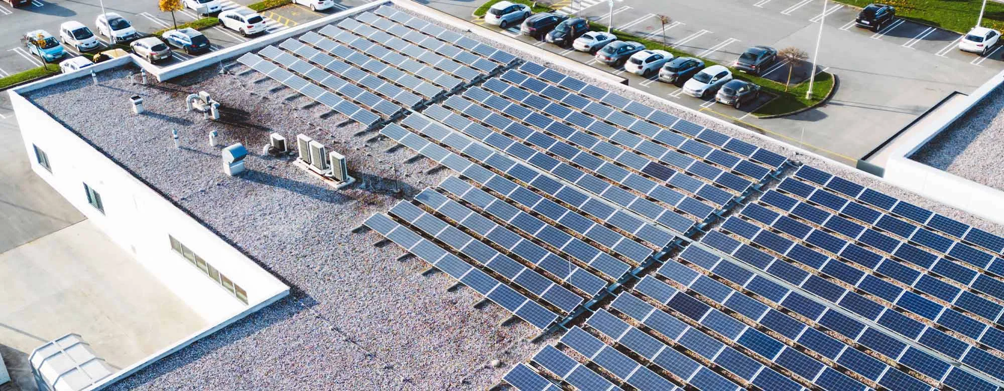 Aerial shot of factory roof with solar panels